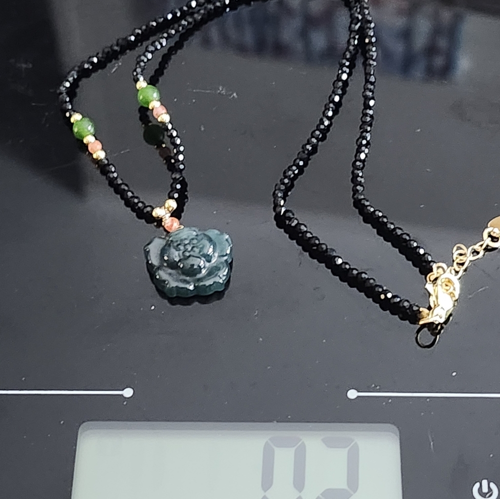 Black and Green Beaded Necklace with Carved Pendant